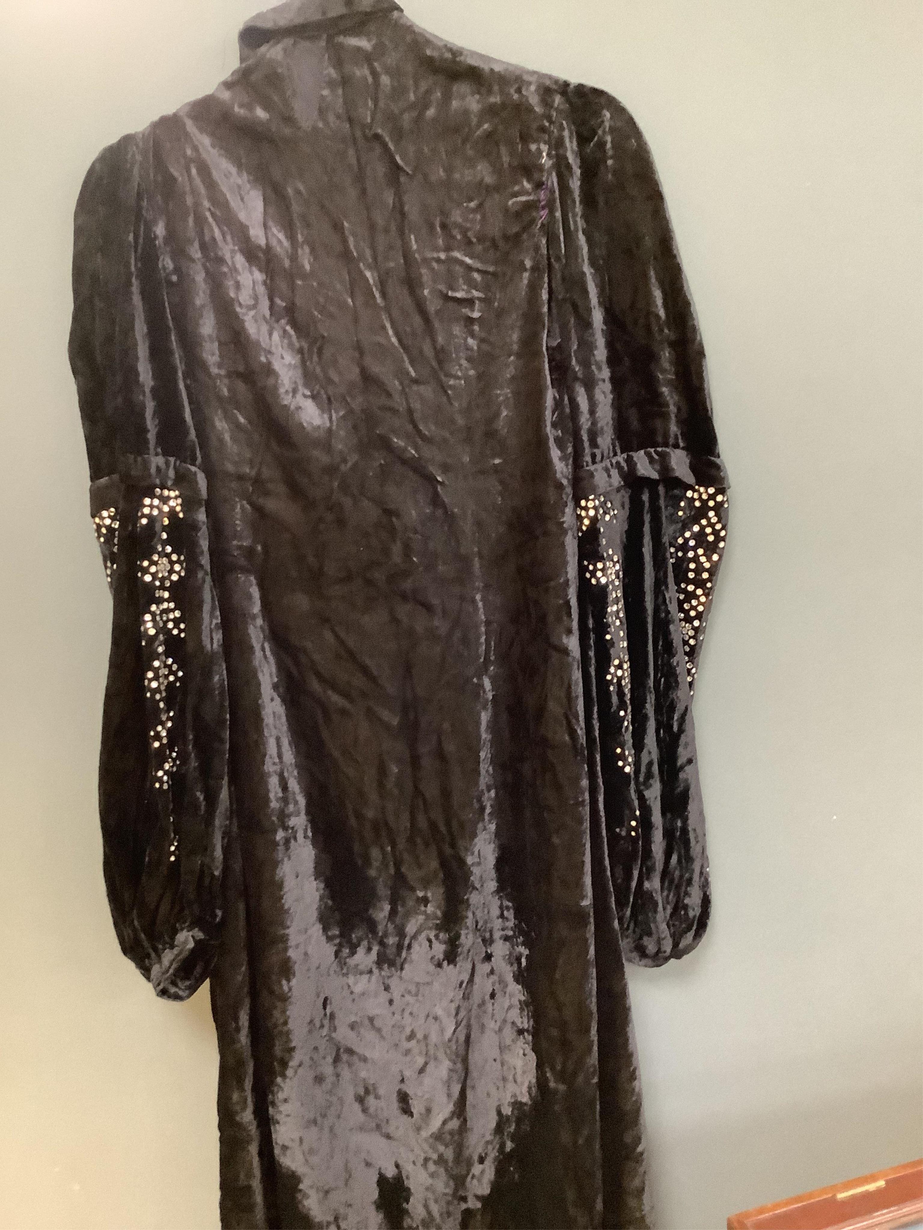 Two Edwardian blouses and three earlier lace camisoles, three black satin partly sewn skirts and later black velvet diamonte decorated evening coat. Condition - the coat, skirts and blouses need repair but are good for T